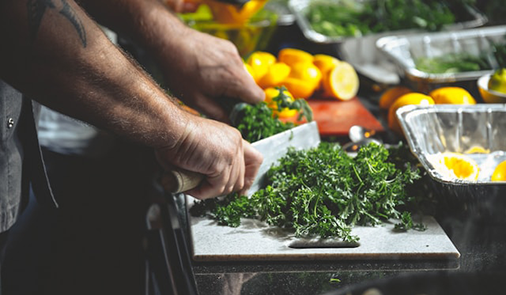 Chef prepping food for customers.