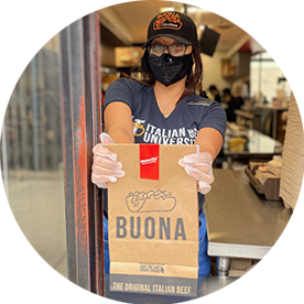 Image of Buona worker giving food to customer.