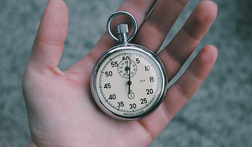 Stopwatch in employees hand.